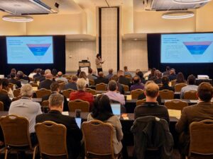 Image of attendees listening to a speaker at the 2026 CMC Conference